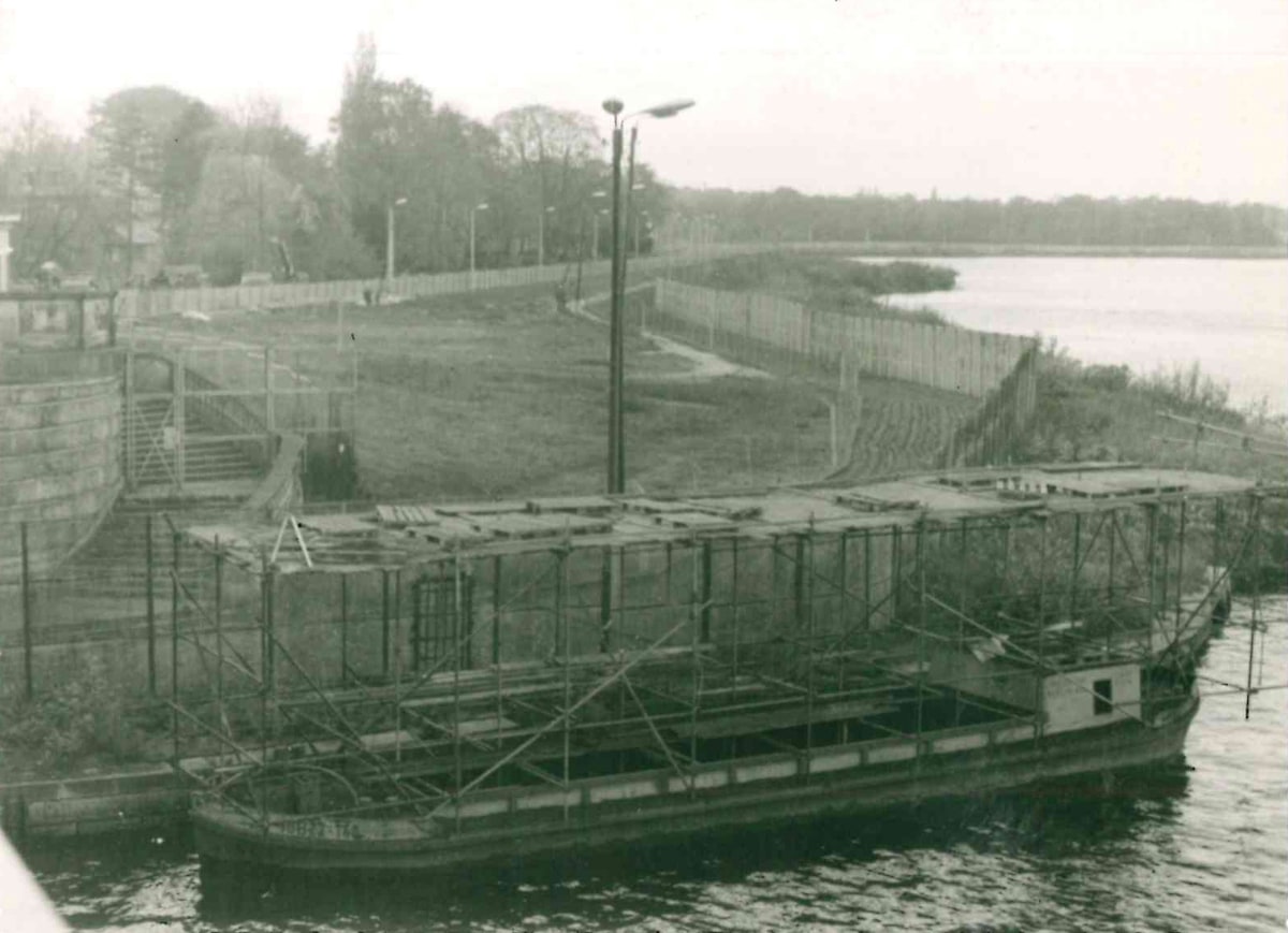 Repair work on the border crossing at Glienicke Bridge with a view of the frontier barriers